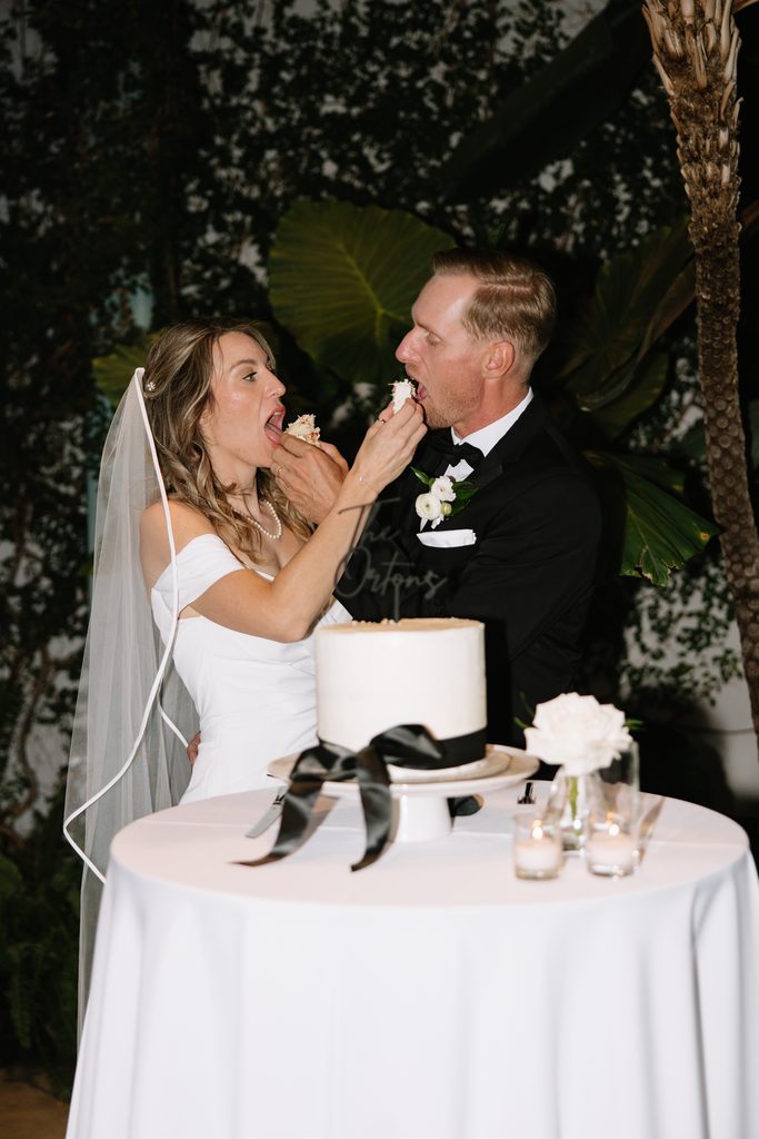 A + M feeding each other their wedding cake during the reception at Red Butte Gardens.