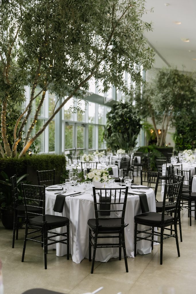Wedding dinner details inside Orangerie at Red Butte Gardens.
