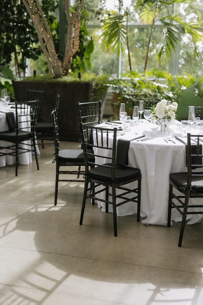 Wedding dinner details inside Orangerie at Red Butte Gardens.