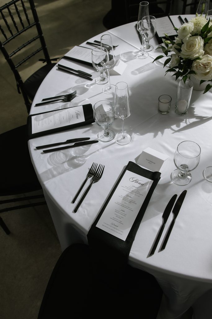 Wedding dinner details inside Orangerie at Red Butte Gardens.