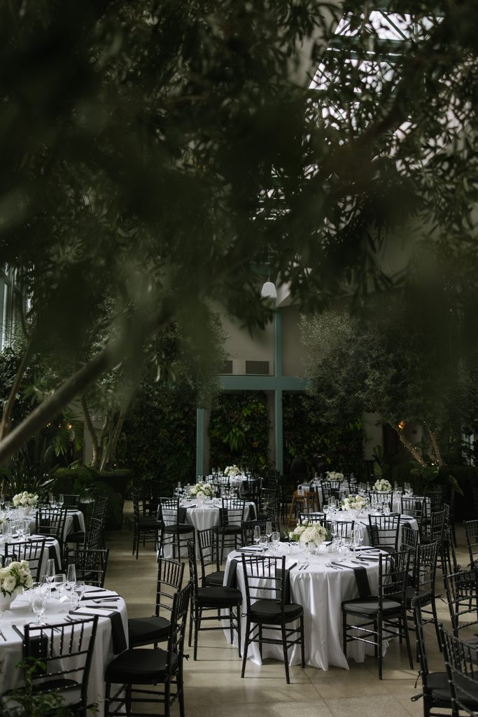 Wedding dinner details inside Orangerie at Red Butte Gardens.