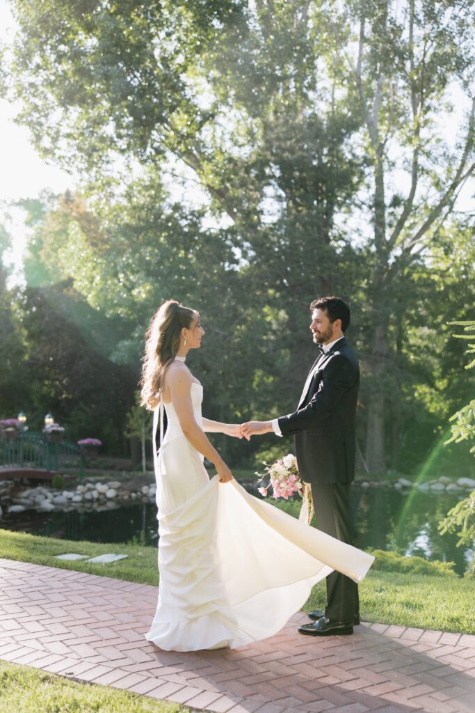 June bridal portraits of M and C among the green gardens at La Caille.
