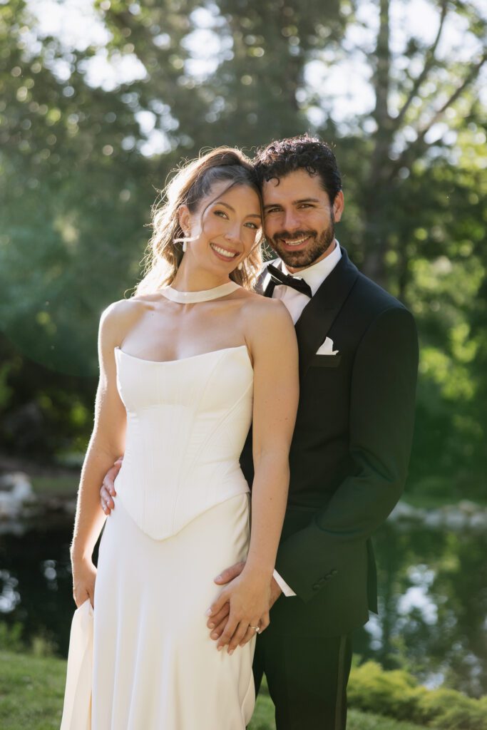 June bridal portraits of M and C among the green gardens at La Caille.