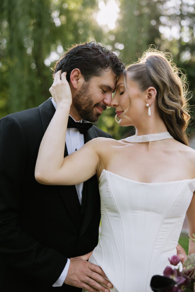 June bridal portraits of M and C among the green gardens at La Caille.